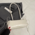 Minimalist white underarm bag with bow decoration on a grey suit background - White without Pendant