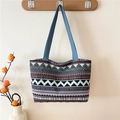 Ethnic blue tote bag with geometric patterns hanging on a wooden hook in a cozy home setting - Style 5