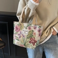 Compact tapestry tote bag featuring red and purple floral patterns and khaki handles - Khaki Small
