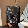 Mini crossbody bag featuring black and white jacquard leaf pattern and leather trim - Black