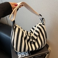 Minimalist black and white striped canvas crescent shoulder bag with adjustable strap - Black