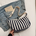 Blue and white striped canvas hobo bag with adjustable strap in casual daily setting - Dark Blue