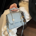 Elegant light blue PU leather crossbody handbag with round buckle and braided detail - With Bell Pendant / Blue