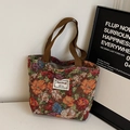 Sac cabas rétro en tapisserie florale avec des poignées tressées marron chic - Café Petit