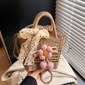 Handwoven straw tote featuring pink crochet flowers and cream lace bow detail - Khaki with Pink and Ribbon Scarf