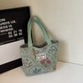 Floral canvas tote bag in mint green with woven handles and woven flower texture - Green Small (Open)