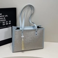 Light blue tote bag with floral embossed patterns and a beaded tassel charm - Chinese Style Tassel Pendant / Blue