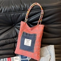 Reversible red plaid canvas tote bag with navy denim pocket and woven colorful handles - Small / Black