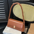 Vintage caramel brown baguette shoulder bag with gold metal buckle and leather finish - Yellow Brown