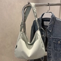 Minimalist mint green nylon crescent bucket bag with wide shoulder strap - Green