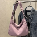 Lavender nylon crescent crossbody bag with adjustable wide strap and dual front pockets - Purple