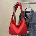 Modern red nylon half-moon crossbody bag with adjustable strap and casual style - Red