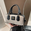 Elegante bolso Boston de tela tejida beige y cuero negro con letras doradas retro - Negro