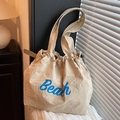 Borsa a tracolla capiente color crema con stampa Beach blu e chiusura a coulisse - Cachi