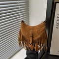 Bohemian style camel suede crescent bag with long fringe details and metal buckle - Tan
