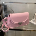 Pink faux leather saddle bag with a unique heart-shaped metal lock and adjustable strap - Pink