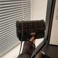 Elegant black and gold tweed crossbody bag with chain strap and metallic lock - Black