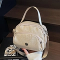 Fashionable cream nylon crossbody bag with three zipper compartments and adjustable strap - Khaki