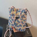 Floral crossbody phone bag with woven texture and colorful rope shoulder strap - Blue