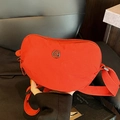 Bright red nylon crossbody bag with heart-shaped silhouette and adjustable wide strap - Red