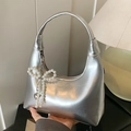 Chic silver crescent hobo bag with a delicate pearl bow charm and heart pendant - Silver with Charm