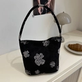 Schwarze Tragetasche mit silbernem floralem Jacquardmuster und Minimalismus - Schwarz