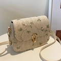 Beige woven straw crossbody bag with delicate floral embroidery and gold metal lock - White