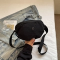 Minimalist black nylon crescent crossbody bag with adjustable strap and metal logo - Black