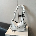 White pleated shoulder bag with black bow print and leather ribbon charm detail - White