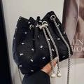 Fashionable black pleated bucket bag with white bow print and pearl drawstring details - Black