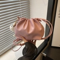 Pink drawstring bucket bag with pleats, gold lettering and a white plush charm - Pink With Long Leg Elf Pendant