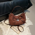 Vintage brown suede dumpling bag with a delicate bow knot and silver heart pendant - Brown