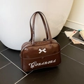Dark brown patent leather shoulder bag with white bow and cursive letter embroidery - Brown