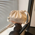 Chic beige pleated leather cloud bucket bag with soft drawstring and plush monster charm - White With Long Leg Elf Pendant