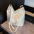 Borsa tote jacquard cinese beige con ricamo dorato e dettaglio con nappa - Argento