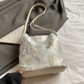 Borsa tote in tela ricamata con farfalle blu, ciondolo a nappa e tracolla rimovibile - Bianco