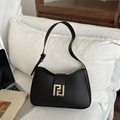 Minimalist black leather underarm bag with elegant gold geometric metal buckle and strap - Black