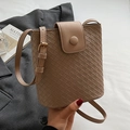 Light brown woven bucket bag with adjustable strap and decorative round buckle detail - Khaki