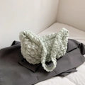 Mint green crescent shoulder bag featuring stylish bubble textured fabric design - Green
