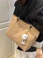 Chic khaki tote bag with textured finish, black straps and cute plush charm detail - Khaki + White Elf Charm