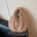 Brown faux fox fur shoulder bag with soft plush texture and minimalist oval design - Khaki