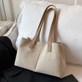 Minimalist beige canvas tote bag with brown leather handles in a chic office setting - Khaki (No Pendant)