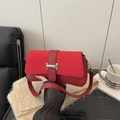 Vibrant red faux leather shoulder bag with silver buckle and stylish suede-texture flap - Red