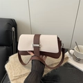 Retro contrast shoulder bag in cream and brown leather with a silver metal clasp - White