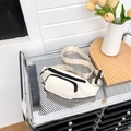Cream colored waterproof oxford cloth waist bag with black zippers and adjustable strap - White