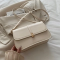 Elegant cream white baguette shoulder bag with gold metal buckle and leather strap - White