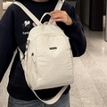 White lightweight nylon backpack with pleated texture and stylish side zipper details - White