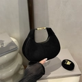 Mini black suede hobo bag with gold clasp and detachable strap on minimal background - Black