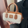 Borsa Boston retrò in tela beige e pelle marrone con tracolla e targhetta del marchio - Marrone