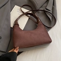 Brown vintage suede patchwork tote bag with chain strap on a grey blazer background - Coffee Without Pendant